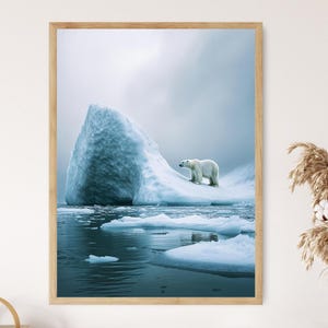 May include: A framed print featuring a polar bear on an iceberg in a cold, blue environment. The bear is white, and the iceberg is a light blue color. The water is a dark blue, and the sky is overcast.