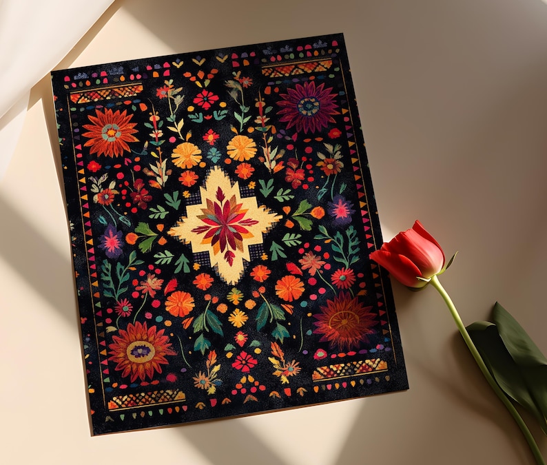 May include: A black background with a colorful floral pattern. The pattern is reminiscent of traditional Mexican embroidery. The flowers are in shades of red, orange, yellow, pink, and blue. The background is black with a subtle texture.