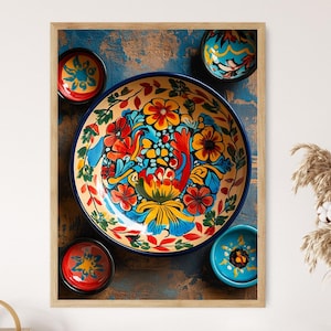 May include: A set of four colourful ceramic bowls with floral designs. The bowls are blue, yellow, red, and green. The largest bowl has a blue rim and a floral design in the centre. The other three bowls are smaller and have a variety of floral designs.
