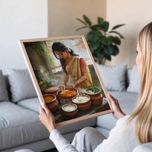 May include: A woman in a white and red sari is preparing food in a kitchen. She is adding ingredients to a pot, and there are other pots of food on the table. The kitchen is decorated with plants and flowers.