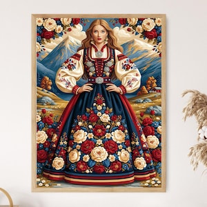 May include: A framed wall art print featuring a person in a dark blue dress with red and white floral embroidery, standing before a mountain landscape. The person wears a white blouse with puffed sleeves and a bodice adorned with intricate floral patterns.