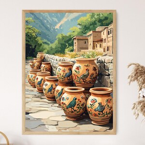 May include: A framed print depicting a row of terracotta pots adorned with floral and bird motifs. The pots are arranged on a stone path, with a stone wall and buildings in the background. The artwork features a warm colour palette.