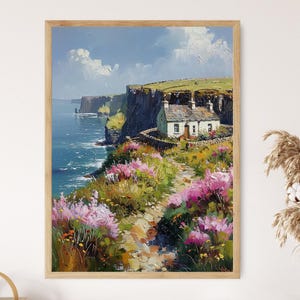 May include: A painting of a white cottage nestled on a cliffside overlooking a blue ocean. The cottage is surrounded by lush green grass and pink flowers. The sky is a bright blue with white clouds.