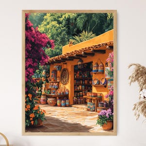 May include: A colorful, yellow building with a tiled roof and a shop front filled with pottery. The building is surrounded by lush green foliage and vibrant pink flowers.