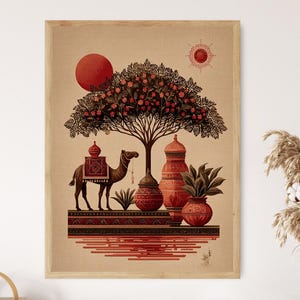 May include: A framed art print featuring a stylized desert scene. A camel with a decorative saddle stands beneath a flowering tree. Red sun and decorative pots are also featured. The artwork has a warm color palette of reds, browns, and beige.