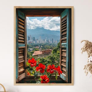 May include: A view of a city skyline through an open window with blue shutters. The window is framed in wood and has a rustic look. Red hibiscus flowers are in the foreground.