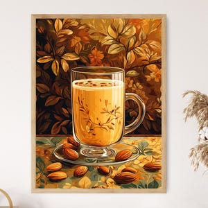 Könnte beinhalten: Gerahmter Kunstdruck mit einem Glas goldfarbenen Getränks mit Henkel, das auf einer kleinen Untertasse steht. Das Glas ist mit einem zarten floralen Design verziert. Verstreute Mandeln umgeben das Glas auf einer gemusterten Oberfläche, mit einem Hintergrund aus Herbstblättern.