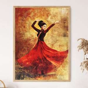 May include: A framed art print featuring a woman in a flowing red dress, mid-dance. She wears a black top with red accents. The background is a textured, golden-yellow with circular patterns. The artwork is framed in a light-colored wooden frame.