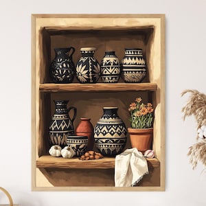 May include: A framed print of a wooden shelf filled with decorative pottery. The black and white patterned vases and jars are arranged on two shelves. A small terracotta pot with orange flowers and a white cloth add color.