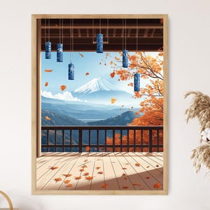 May include: A framed print of a Japanese landscape featuring Mount Fuji. The scene includes a wooden deck, a black railing, and hanging blue lanterns. Autumn leaves fall in the foreground, with orange trees and mountains in the background.