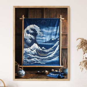 May include: A blue and white tapestry depicting the Great Wave off Kanagawa, a famous Japanese woodblock print by Hokusai. The tapestry is hanging on a wooden frame with bamboo poles.