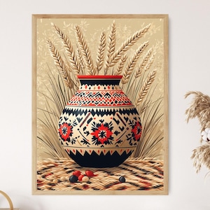 May include: A framed print featuring a decorative vase with a black, red, and cream floral pattern. The vase is filled with wheat stalks. The print is set on a beige background and framed in a light wood.
