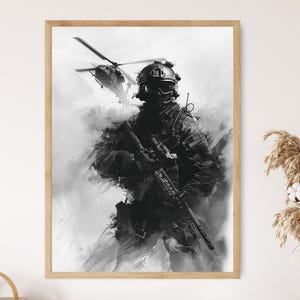 May include: Framed monochrome print depicting a soldier in combat gear, holding a rifle, with a helicopter overhead. The artwork uses a painterly technique with brushstrokes, creating a dramatic and intense scene.