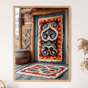 May include: A framed image of a doorway with a colorful, patterned rug hanging on the door and a smaller rug on the floor. The rugs feature red, orange, blue, and white designs. The door is blue, and the surrounding structure is made of wood.