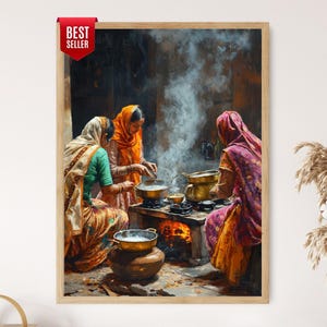 May include: A framed wall art print depicting three individuals in traditional attire cooking over an open fire. The scene features metal pots on a stone stove with visible smoke rising, set against a dark background. A red Best Seller tag is attached.