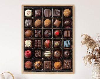May include: A framed assortment of chocolates in a black tray. The chocolates vary in shape, size, and color, including dark, milk, and white chocolate. Some are decorated with stripes, nuts, or other toppings. The frame is made of light-colored wood.