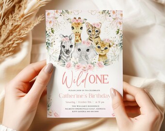 May include: A pink and green invitation card with a watercolor illustration of a giraffe, zebra, elephant, and lion. The text on the card reads "Wild One" and "Catherine's Birthday".