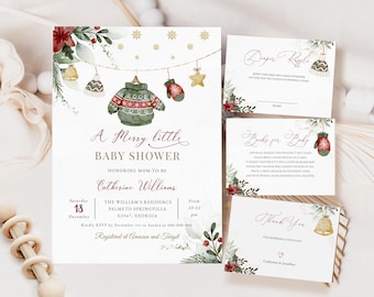 May include: A white baby shower invitation featuring a watercolour design of a green sweater, red mittens, and gold bells hanging from a string. The text reads "A Merry Little Baby Shower" and includes the date, time, and location of the event. The invitation also includes an RSVP request and information about the registry.