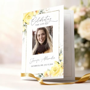 May include: A white funeral program booklet featuring a gold-bordered frame, yellow watercolor roses, and green leaves. The text reads Celebrating the life of, Jennifer Allsandra, and October 20, 1985 - July 13, 2018, with a central portrait photo.