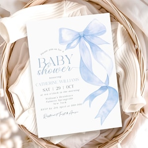 May include: A baby shower invitation with a light blue watercolor bow and ribbon design. The invitation includes the text "BABY shower" and details for Catherine Williams' shower, including the date, time, and location in New York.