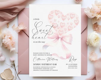 May include: A pink and white baby shower invitation with a watercolor illustration of a heart-shaped balloon with a pink ribbon bow. The text reads "A little Sweet heart is on the way".