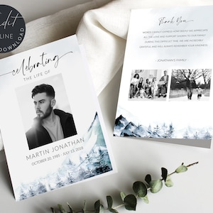 May include: A memorial card with a watercolor background of a snowy mountain range. The card features a black and white photo of a man and the text "celebrating the life of Martin Jonathan October 20, 1985 - July 13, 2018". The back of the card has a thank you message from Jonathan's family and two black and white photos of the family.