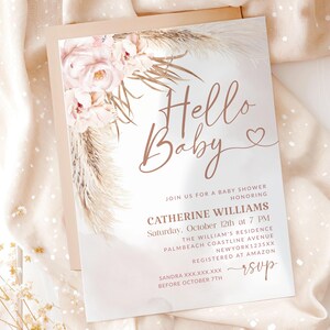 May include: A baby shower invitation with the words "Hello Baby" in elegant script. The invitation features floral and pampas grass accents in soft pink and beige tones. Details include the honoree's name, date, time, and location.