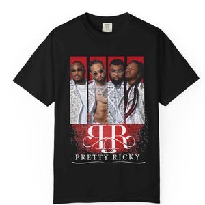 May include: Black t-shirt featuring a graphic of four men in a collage with a red background. The text "Pretty Ricky" is below the image in white. The shirt has a crew neck and short sleeves.