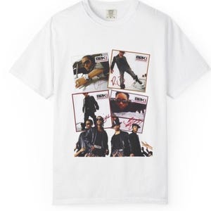 May include: White t-shirt featuring a collage of images of a music group. The images are in rectangular frames with the group's name, "B2K," and signatures. The group members are wearing sunglasses and leather jackets.