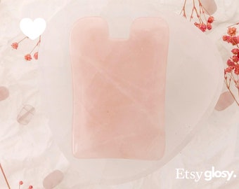 Outil de massage facial gua sha en quartz rose et patte d'oie