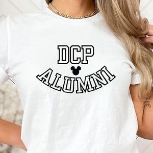 May include: A handmade wooden sign with the text "Welcome" in a playful font. The sign is painted white with a distressed finish, and features a small, decorative heart. Dimensions are approximately 12 inches wide and 6 inches tall.