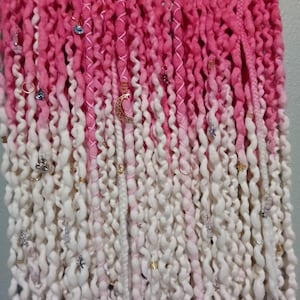 May include: A rustic wooden sign with the text "Welcome to our home" in white lettering. The sign features a distressed finish and a simple, inviting design, perfect for a front porch or entryway.