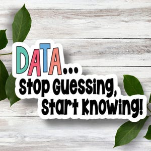 May include: A white sticker with the text "DATA... stop guessing, start knowing!" in black lettering. The word "DATA" is in colorful letters with a blue "D", a pink "A", a light blue "T", and a peach "A".