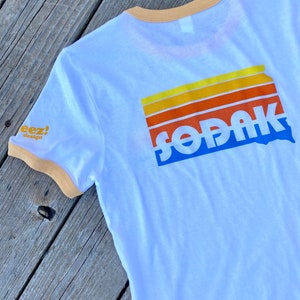 SoDak Sunset White and Yellow Ringer T-shirt  - South Dakota Unisex Ringer Tee with Front, Back & Sleeve print - Ringer by Oh Geez! Design