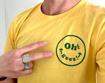 Oh Geez! Design Smiley T-shirt - Oh Geez! Smiley Face Heather Yellow Unisex T-shirt - Smiley Face Wink Tee for Men and Women - Yellow Gold