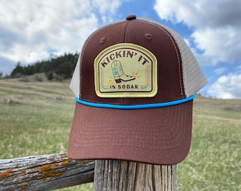 Kickin It in SoDak Snapback Rope Hat by Oh Geez! Design - South Dakota Western Patch Trucker Hat - Brown Retro SoDak Cowboy Boot Rope Hat