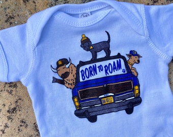 Born To Roam Baby Onesie - SoDak Buffalo, Puppy, Dog and Wagoneer Baby Onesie by Oh Geez! Design - South Dakota Road Trip White Bodysuit