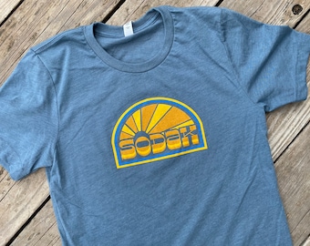 Unisex SoDak Sunbeams T-shirt - Mens Womens South Dakota Sunbeams Slate Blue T-shirt by Oh Geez! Design - Screen printed SoDak Graphic Tees