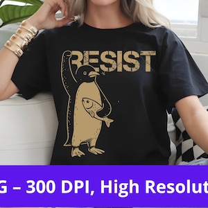 Peut inclure: T-shirt noir avec un graphique d'un pingouin tenant un poisson et le mot "RESIST" en lettres usées.