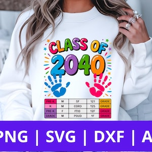 May include: White sweatshirt with a colorful graphic that says "CLASS OF 2040". The design includes handprints and a chart with school grade information. The bottom of the image has the text "PNG | SVG | DXF | AI".