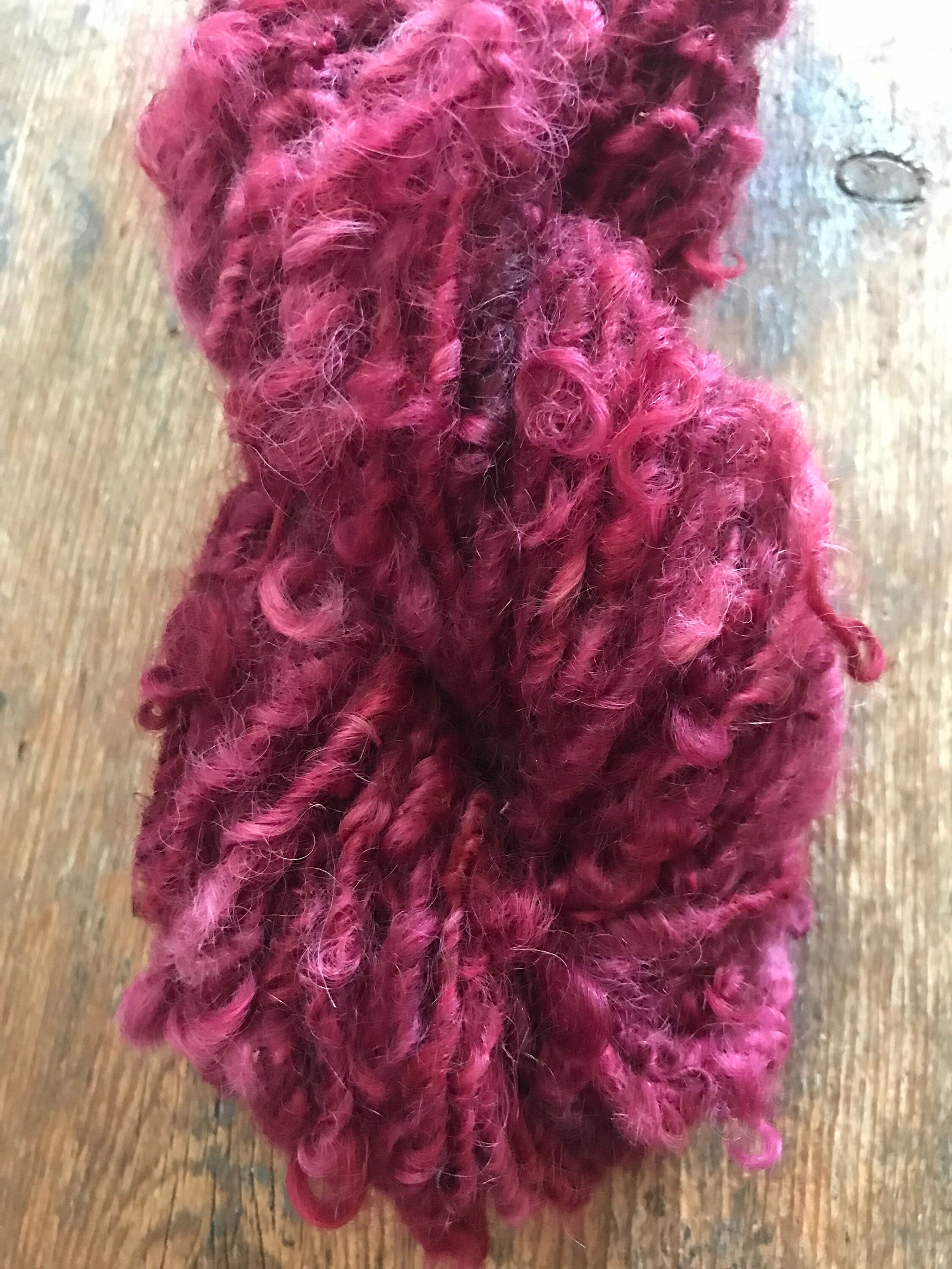 Merrily We Roll Along, burgundy curly 20 yards handspun yarn - Image 1