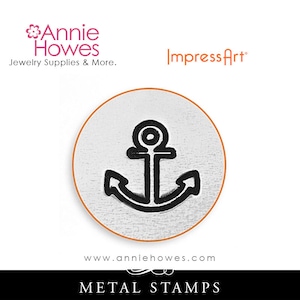 May include: A silver metal stamp featuring a black anchor design. The stamp is round and has the text "ImpressArt" at the top and "www.anniehowes.com" at the bottom. The text "METAL STAMPS" is below the stamp.
