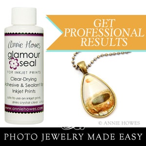 May include: A bottle of clear-drying adhesive and sealant for inkjet prints called "glamour seal" by Annie Howes. The bottle is labeled with the text "FOR INKJET PRINTS", "Clear-Drying Adhesive & Sealant for Inkjet Prints", "safe to use on inkjet prints", "dries crystal clear", and "www.anniehowes.com".