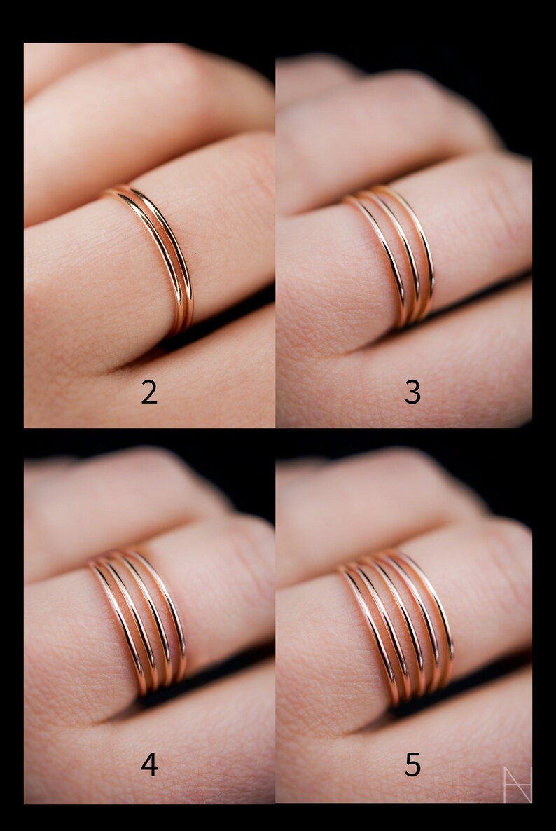 K&ouml;nnte beinhalten: Ros&eacute;goldene Ringe mit unterschiedlicher Anzahl an B&auml;ndern. Die Abbildung zeigt Ringe mit zwei, drei, vier und f&uuml;nf B&auml;ndern. Die Ringe haben ein schlichtes, elegantes Design.