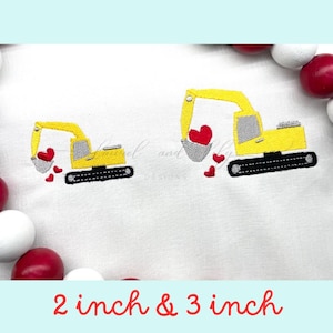 May include: Two yellow toy excavators with red hearts in their buckets. The larger excavator is 3 inches tall and the smaller excavator is 2 inches tall.