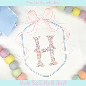 May include: An embroidered design with a floral letter 'H' inside a shield, decorated with a pink bow and ribbons. The design is on a white background, with the text 'Font not included' at the top. The sizes are 4x4, 5x5, 6x6, and 8x8.