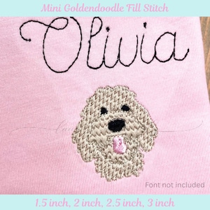 May include: Pink fabric with the name "Olivia" embroidered in black cursive above a beige Goldendoodle design. The design includes a black nose and eyes, and a pink tongue. The text "Mini Goldendoodle Fill Stitch" is at the top.