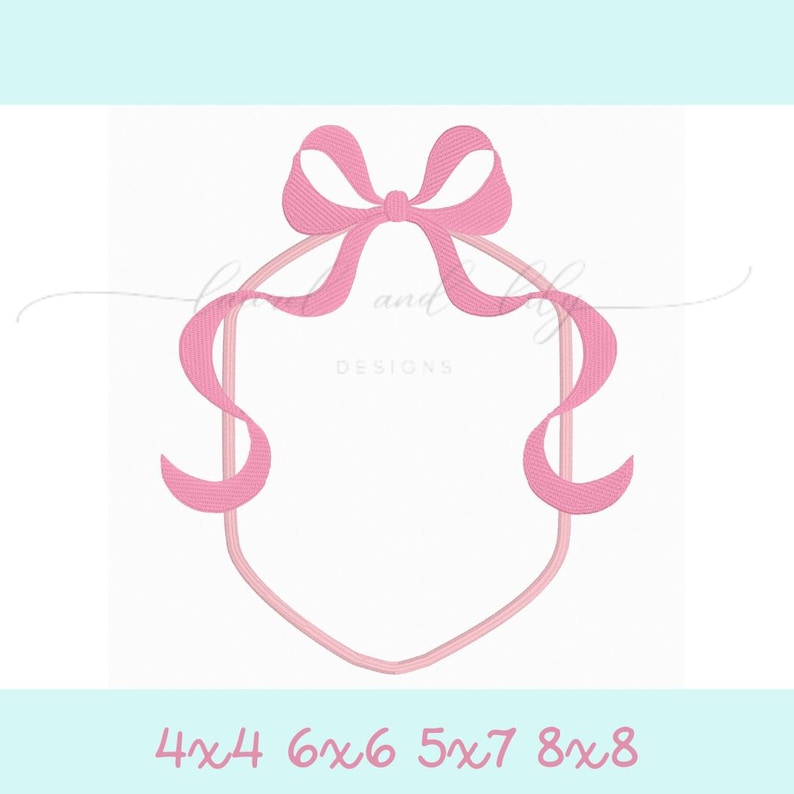 May include: Pink ribbon bow frame with a hexagon shape. The bow is tied at the top of the frame and the ribbon tails extend down the sides of the frame.