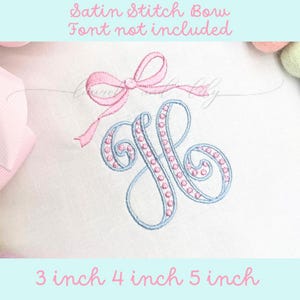 May include: A blue satin stitch monogram with pink pearl accents and a pink satin stitch bow. The monogram is available in 3, 4, and 5 inch sizes.  Font not included.
