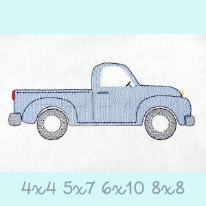 May include: A blue pickup truck with a white cab and a bed. The truck has a yellow light on the front and black tires.